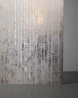A white wall illuminated by a Meystyle Conductivity LED Wallpaper with Swarovski.